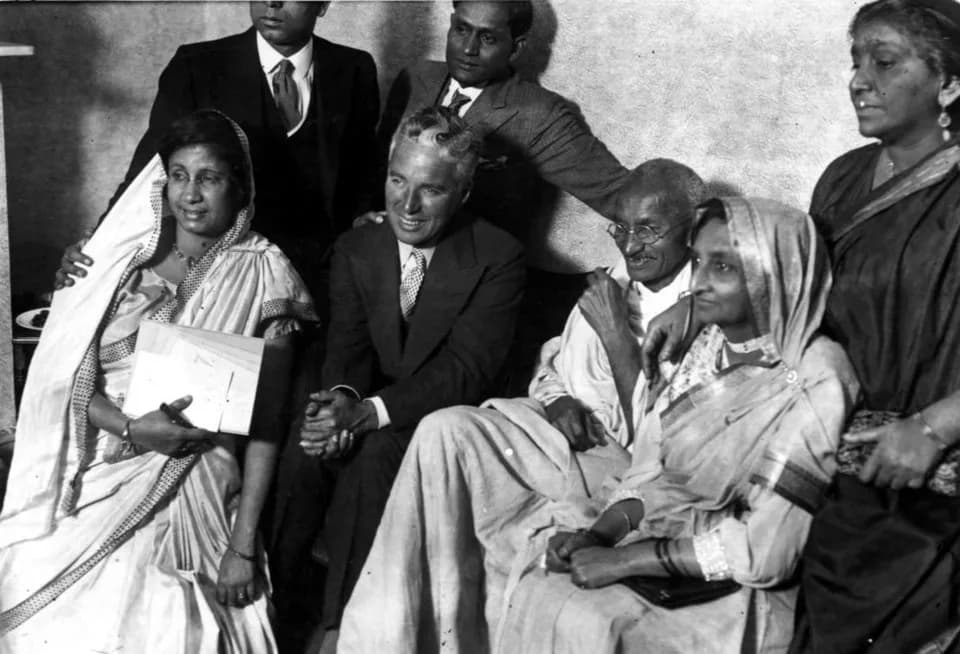Sarojini Naidu - Gandhi meets with Charlie Chaplin at the home of Dr. Kaitial in Canning Town, London, September 22, 1931. Sarojini Naidu is standing on the right.