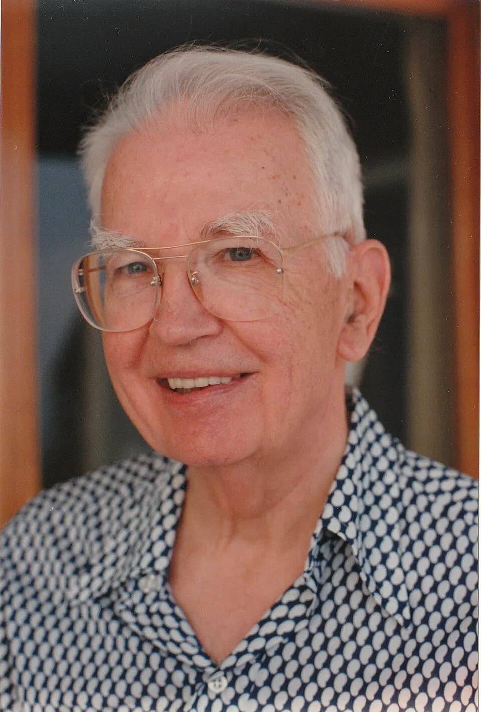 Ronald Coase - Ronald Coase smiling. From UChicago Law archives.