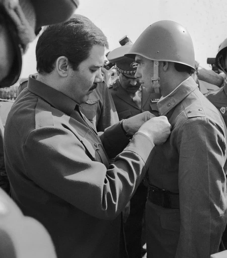 Mohammad Najibullah - “Najibullah giving decorations”. Najibullah (left), general secretary of the People's Democratic Party of Afghanistan, giving decoration to a Soviet serviceman
