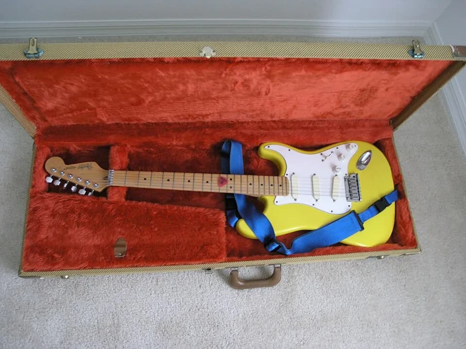 River Phoenix - Yellow Fender American Stratocaster of Sky Phoenix (aka George Siewierski) guitar used as Alekas Attic backup guitar by River Phoenix mostly used on the song by Josh McKay "Gold Mine"