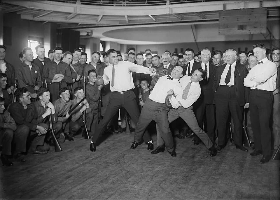 Harry Houdini - "Dempsey, Houdini, Leonard (boxing)". 1 negative : glass ; 5 x 7 in. or smaller. Jack Dempsey (l), Harry Houdini (center), and Benny Leonard (r) spar at a publicity event.