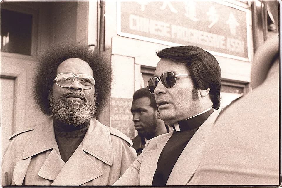 Jim Jones - Reverend Cecil Williams and San Francisco Housing Commissioner Jim Jones at anti-eviction rally at the I-Hotel, 848 Kearny Street in San Francisco, Sunday, January 16,1977. Photograph by