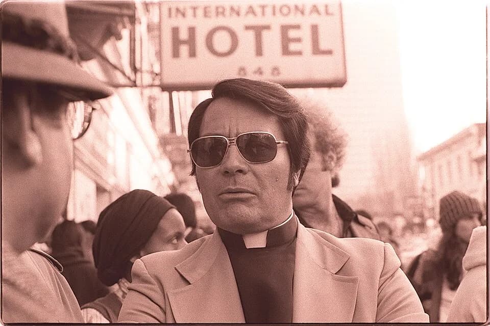 Jim Jones - San Francisco Housing Commissioner Jim Jones at an anti-eviction rally at the I-Hotel at 848 Kearny Street in Manilatown, Sunday, January 16, 1977. Seen behind Jones is Tim Tupper (Jones'