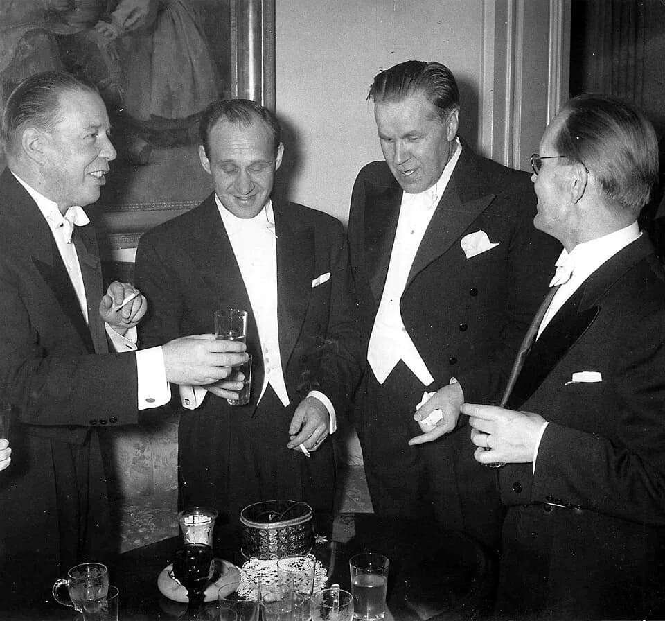 Mika Waltari - Photograph of Mika Waltari, Väinö Linna, Edvin Laine and Lauri Viljanen at Finland’s Independence Day reception, Presidential Palace, Helsinki.