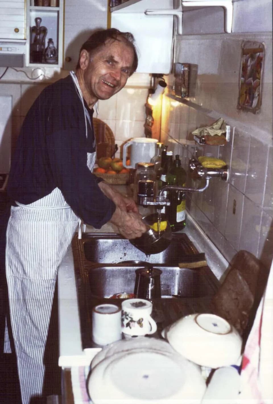 Paul Feyerabend - The philosopher Paul Feyerabend scrubbing dishes. According to his auto-biography Killing Time, this picture was a favourite.