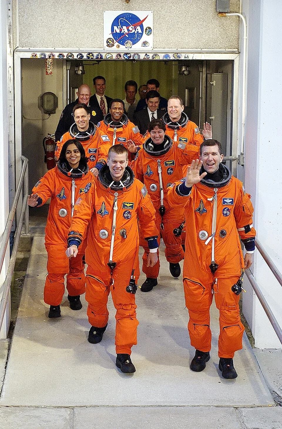 Ilan Ramon - The STS-107 crew, waving to onlookers, exits the Operations and Checkout Building on their way to Launch Pad 39A for liftoff.
Leading the way are Pilot William "Willie" McCool (left) and