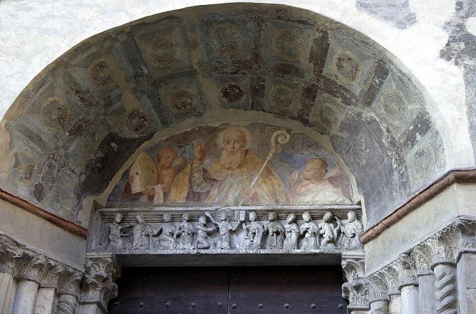 Hilarius - Lunette of the portal of the former church of Saint Hilarius, in Piacenza, Italy, showing a fresco of Saint Hilarius, and a Romanesque-style relief showing Christ and the apostles. Picture