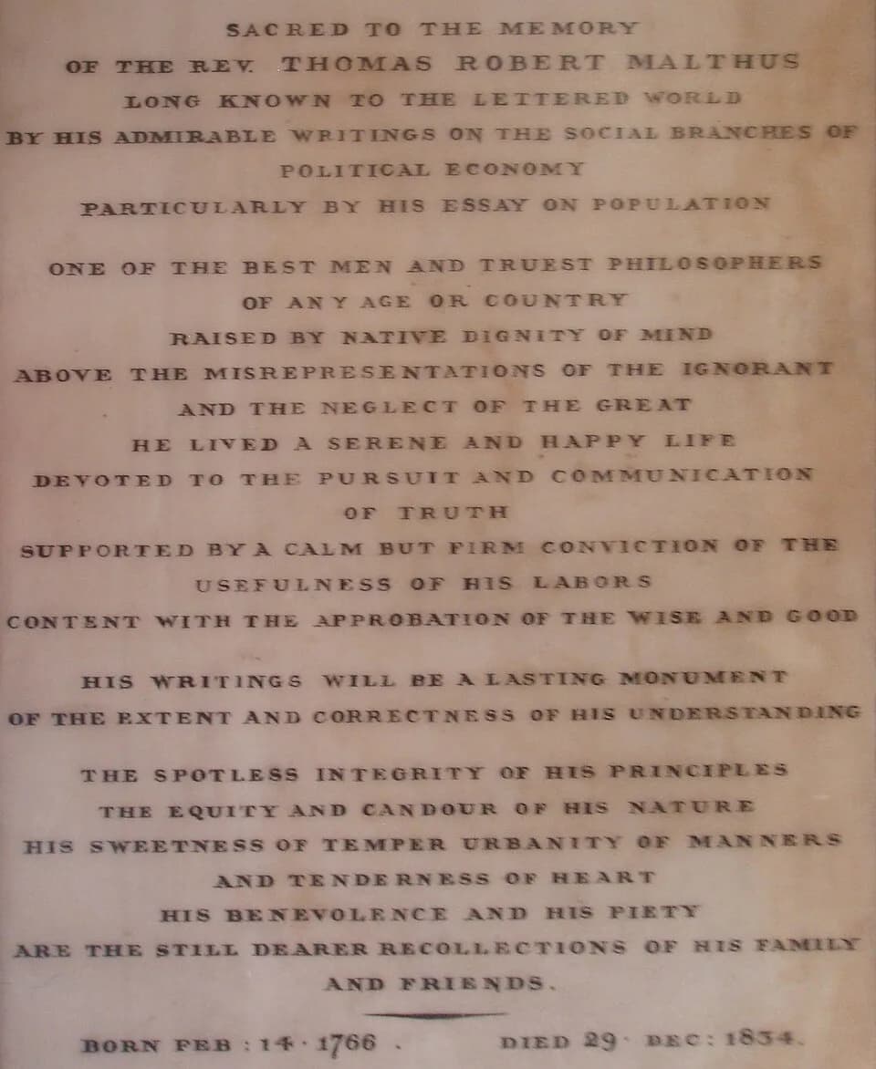 Thomas Robert Malthus - This is a photo of the epitaph of Thomas Malthus in the entrance to Bath Abbey. The perspective distortion has been removed using The Gimp. Photo taken 3 August 2008.