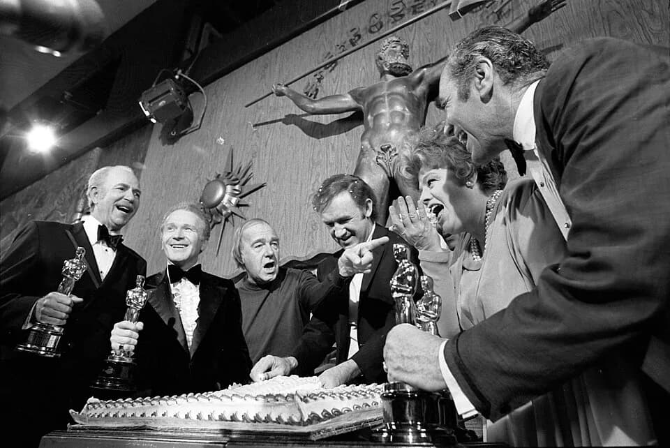 Ernest Borgnine - Academy Award winner Gene Hackman cuts cake on set of his new film, The Poseidon Adventure, at 20th Century Fox. Other members of cast who previously had won Oscars join in celebrati