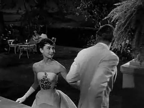 William Holden - Screenshot of Audrey Hepburn and William Holden from the trailer for the film w:en:Sabrina (1954 film)