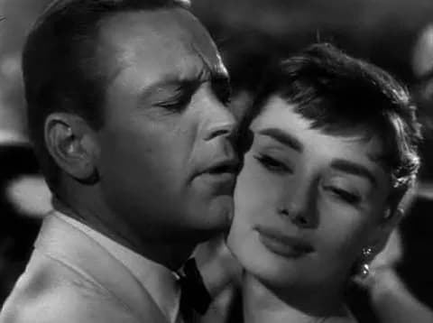 William Holden - Screenshot of William Holden and Audrey Hepburn from the trailer for the film w:en:Sabrina (1954 film)