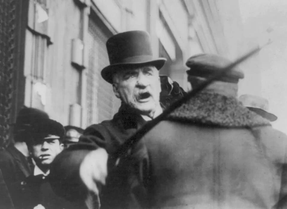 J. P. Morgan - J. P. Morgan beating a photographer with his stick.jpg