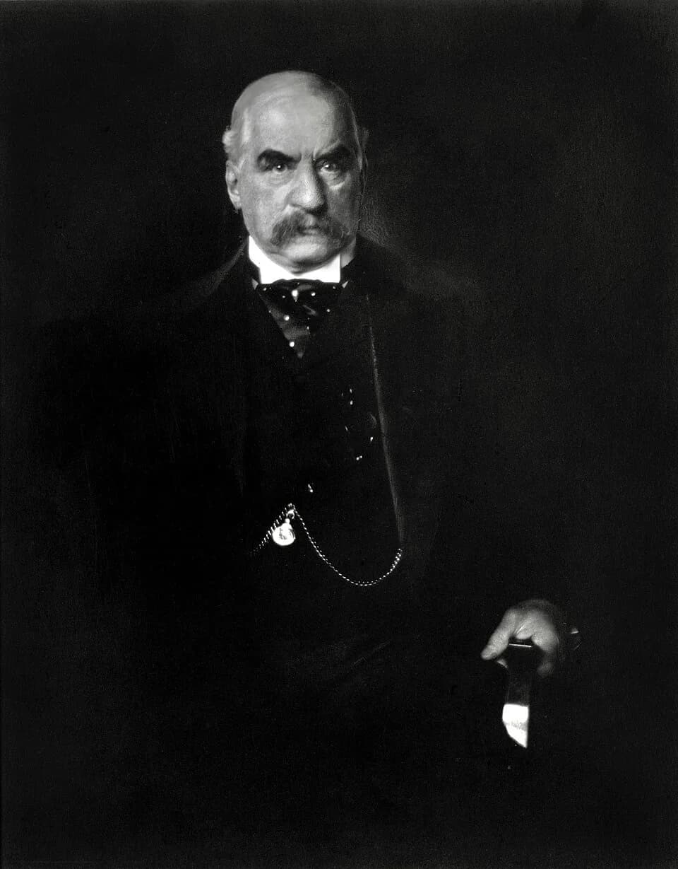 J. P. Morgan - J.P. Morgan photographed by Edward Steichen; photo known for the light reflected off the armrest being interpreted by viewers as a knife.