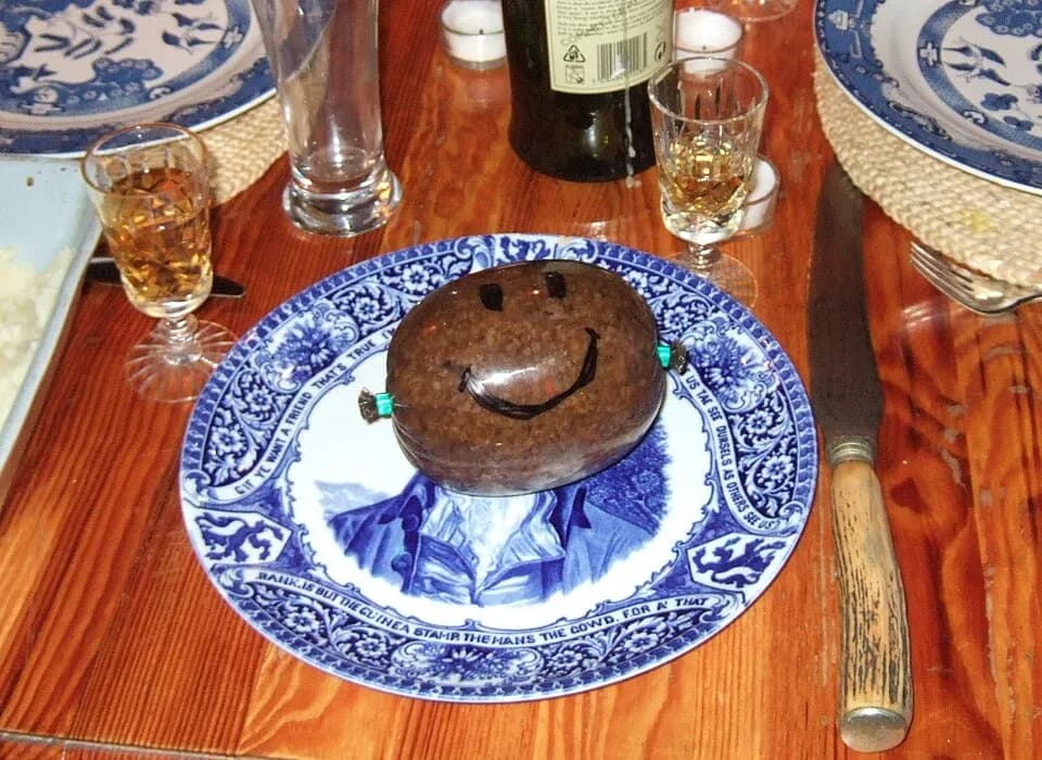 Robert Burns - A haggis which has had a face drawn on the plastic wrapping. The plate it is sitting on depicts Rabbie Burns. To make this even more amusing, it is actually a vegetarian haggis!
