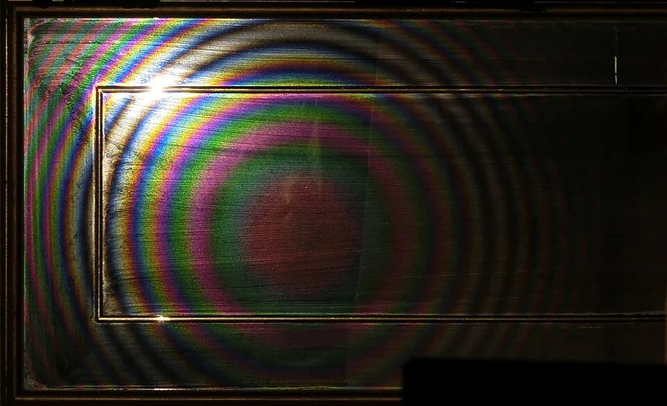 Adolphe Quetelet - Quetelet rings on a dusty mirror as seen by a camera with a flash light to the bottom and right from the camera and approximately twice as close to the mirror as the camera.