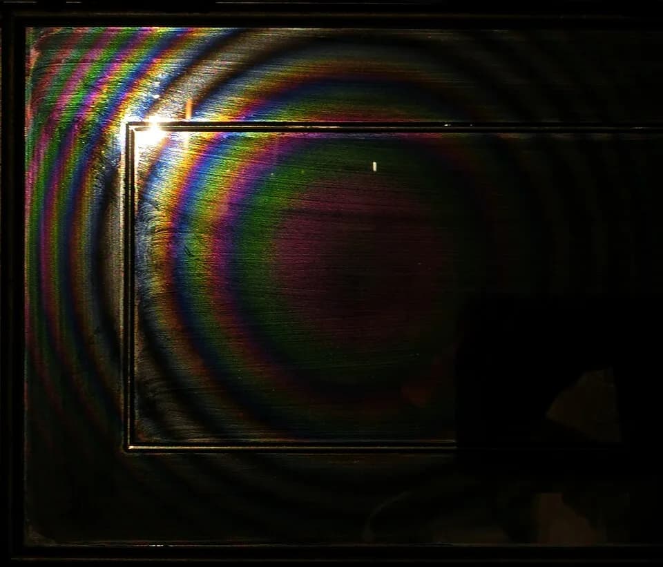 Adolphe Quetelet - Quetelet rings on a dusty mirror as seen by a camera with a flash light to the up and left from the camera and approximately twice as far from the mirror as the camera.
