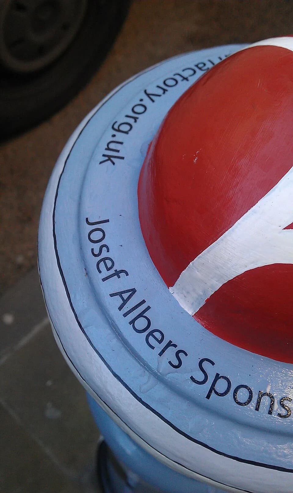 Josef Albers - Top of a bollard in Winchester, England, painted in the style of Treble Clef by Josef Albers. This is one of a series, on the corner of Great Minster Street and The Square, painted by h
