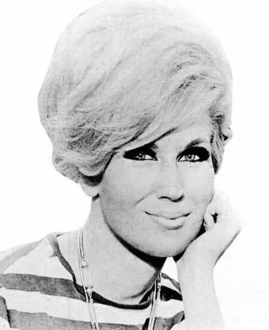 Dusty Springfield - Trade ad for Dusty Springfield's single "Give Me Time".To better adapt it to his respective Wikipedia article, the ad was cropped and cleaned in a graphics editing program. The ori
