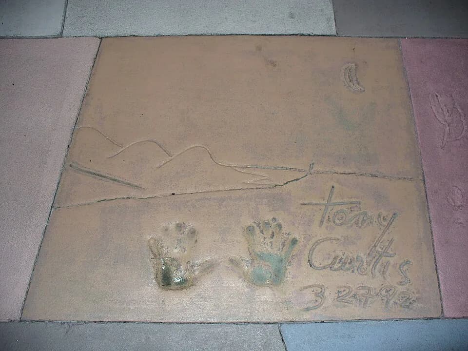 Tony Curtis - I am the originator of this photo. I hold the copyright. I release it to the public domain. This photo depicts the handprints of Tony Curtis in front of The Great Movie Ride at Walt Disn