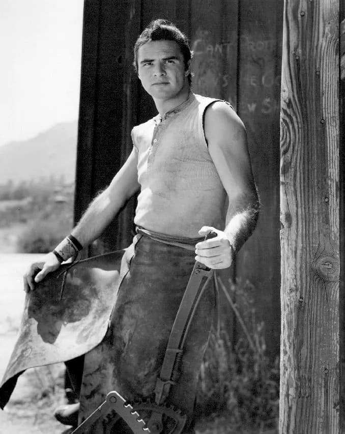 Burt Reynolds - Publicity photo of Burt Reynolds as blacksmith Quint Asper from the television program Gunsmoke.