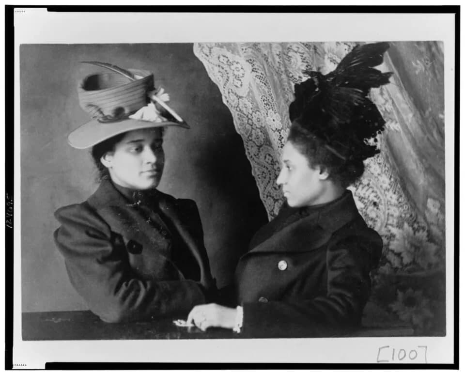 W. E. B. Du Bois - Two African American women, half-length portrait, facing each other