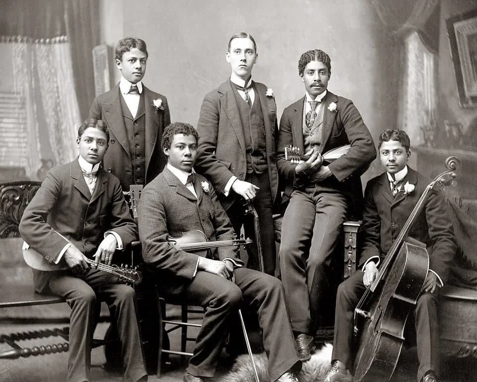 W. E. B. Du Bois - Summit Avenue Ensemble
Photograph shows a group of six young men posed with their instruments in the photographer's home studio located on Summit Avenue, Atlanta, Georgia. From left