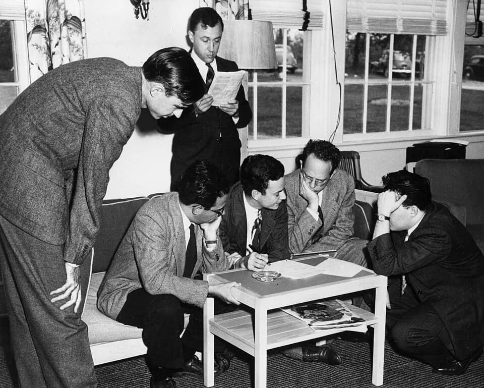 Willis Lamb - Willis Lamb, Abraham Pais, John Wheeler, Richard Feynman, Herman Feshbach, and Julian Schwinger around a table at the 1947 Shelter Island Conference.