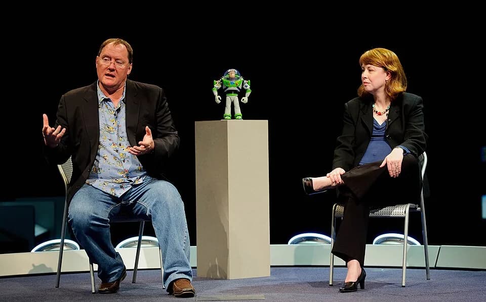 Jim Varney - John Lasseter, Director of the film "Toy Story", left, and Margaret Weitekamp, a curator at the Smithsonian National Air and Space Museum, conduct a discussion at the museum's Moving Beyo