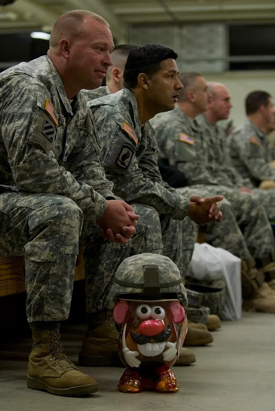 Don Rickles - Mr. Potato Head dons his camouflage helmet to help less fortunate children as Sgt. Jeffrey Reick of the 301st Psychological Operation Company (Airborne) waits to drop off his toy during