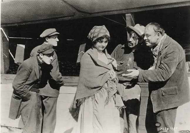 Harold Lloyd - L. to R. : Harold Lloyd, unknown, Jane Novak, unknown actor, and Roy Stewart in From Italy's Shores (1915) - cropped screenshot