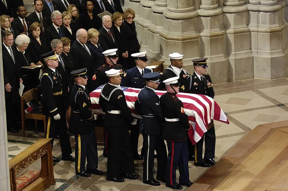 Rosalynn Carter - The casket of President Gerald R. Ford is carried past a group that includes President George W. Bush, first lady Laura Bush and Presidents George Bush Sr., Bill Clinton and Jimmy Ca