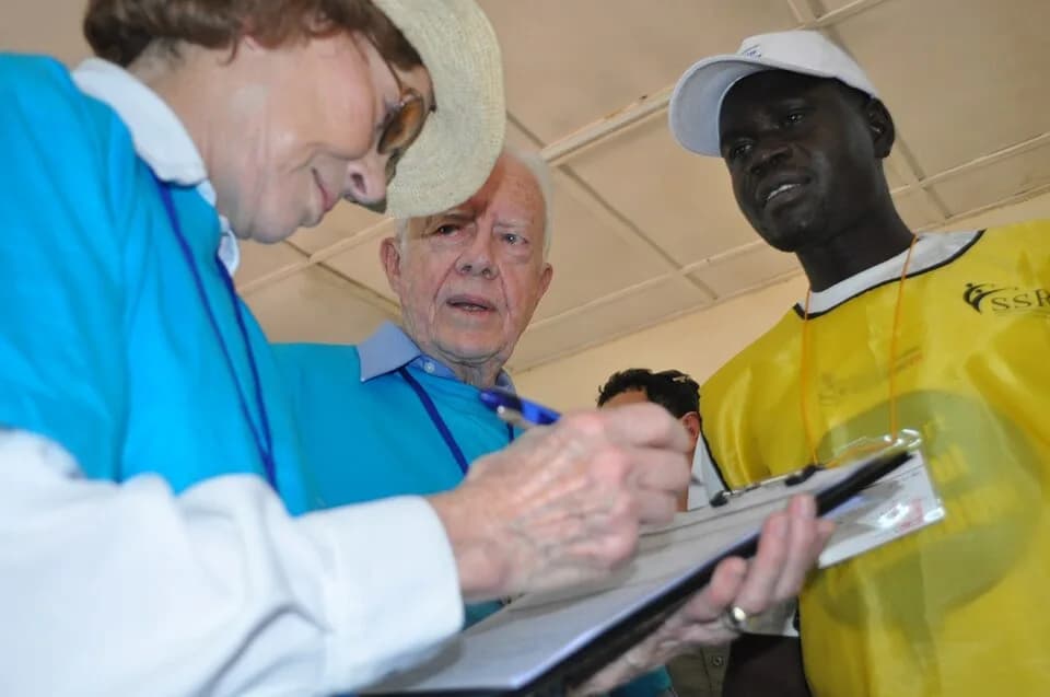 Rosalynn Carter - Former U.S. President Jimmy Carter visits a referendum polling center at Juba University with former First Lady Rosalynn Carter and a Sudanese poll worker on January 11, 2011. Former