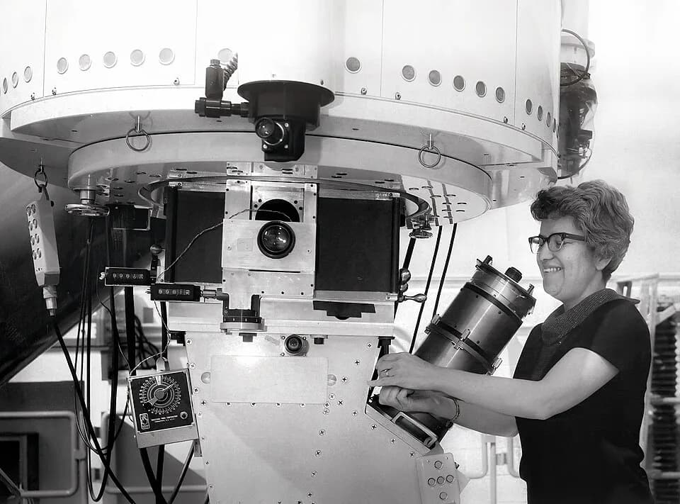 Vera Rubin - Photograph of Vera Rubin at Kitt Peak National Observatory in the 1970s operating the observatory's No.1. 36-inch telescope. Kent Ford’s Image tube spectrograph is attached to the telesco
