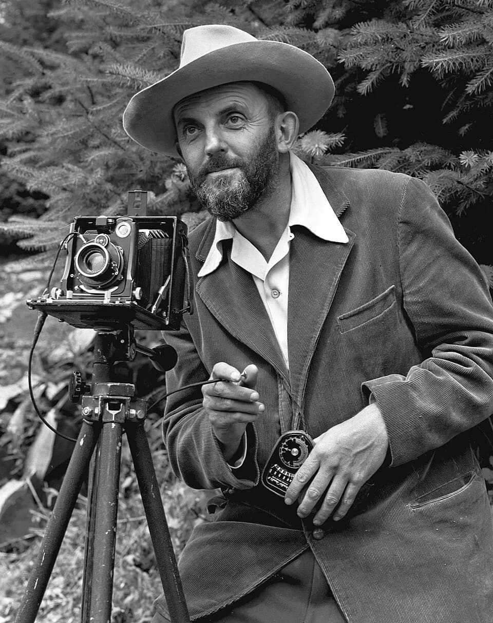 Ansel Adams - Photographic portrait of nature photographer Ansel Adams — which first appeared in the 1950 Yosemite Field School yearbook. The camera is probably a Zeiss Ikon Universal Juwel.
