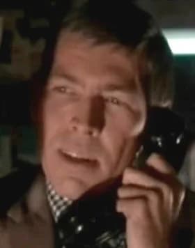 James Coburn - Screenshot of James Coburn from the film Charade