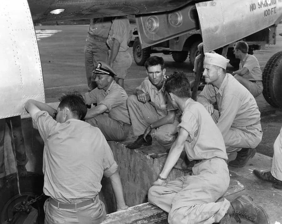 Norman Foster Ramsey - Deak Parsons (right) supervises loading the Little Boy bomb into the B-29 Enola Gay. Norman Ramsey is on his left, with his back to the camera.