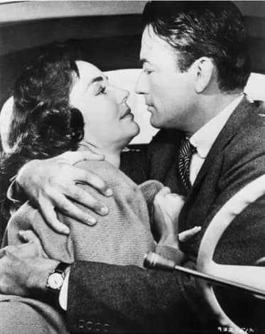 Jennifer Jones - Jennifer Jones & Gregory Peck in American drama film The Man in the Gray Flannel Suit (1956). See also film still. No copyright notice.