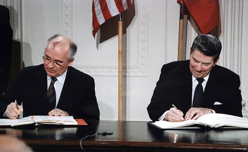Ronald Reagan - President Reagan (1911–2004) and General Secretary Gorbachev (1931–2022) signing the INF Treaty in the East Room of the White House on 8 December 1987
